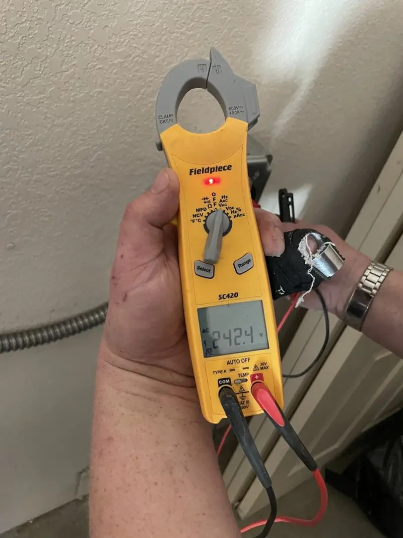 Voltage testing with clamp meter during Electrical Installation Services in Dallastown